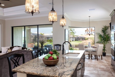 Enjoy the views of the preserve and private lake while preparing food.